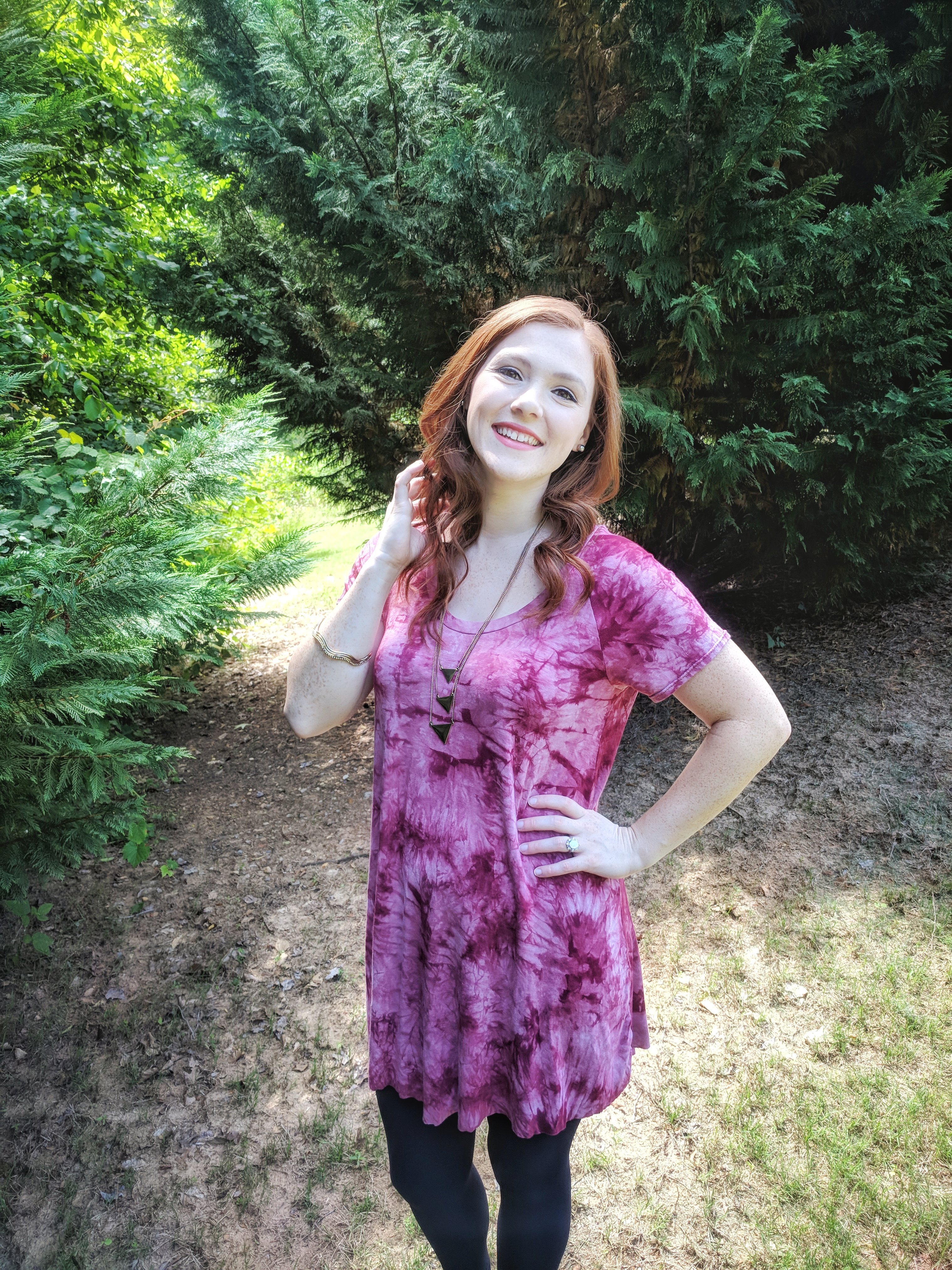 red and pink tie dye tunic with black leggings on girl