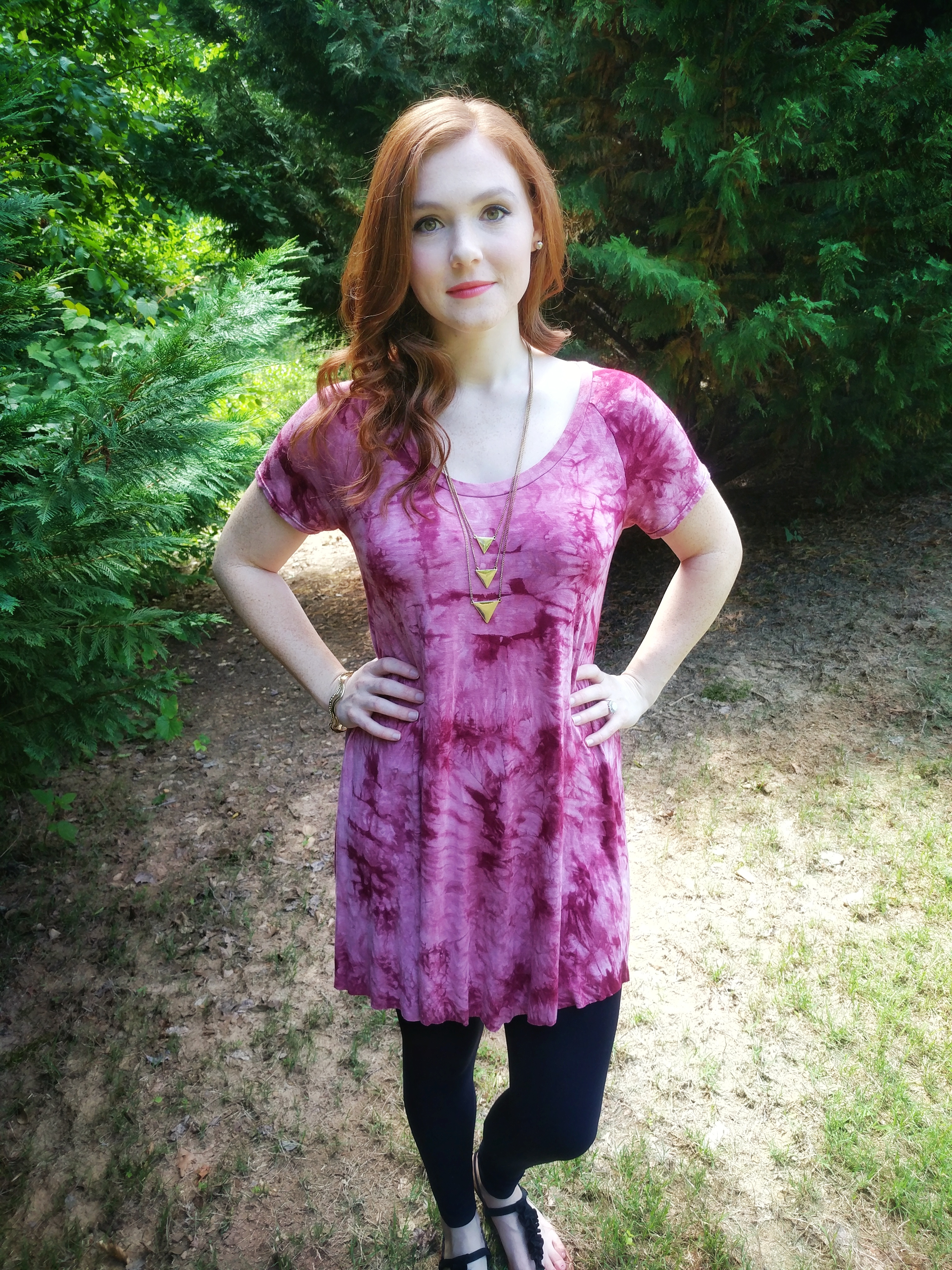 red and pink tie dye tunic with black leggings on girl