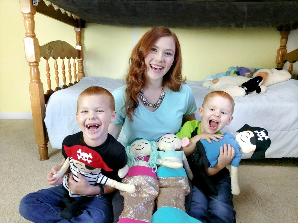 family with stuffed pirates and mermaids