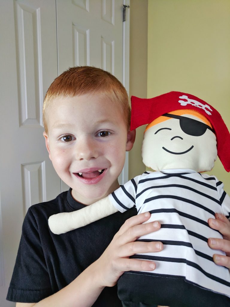 Little boy with stuffed pirate