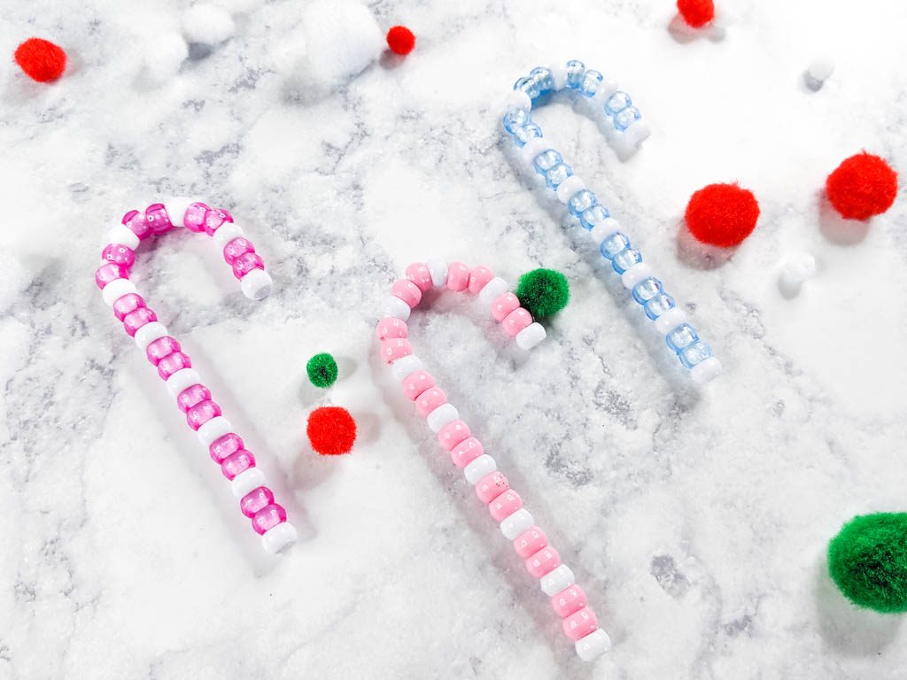 Candy cane ornaments made with pink, blue and white pony beads.