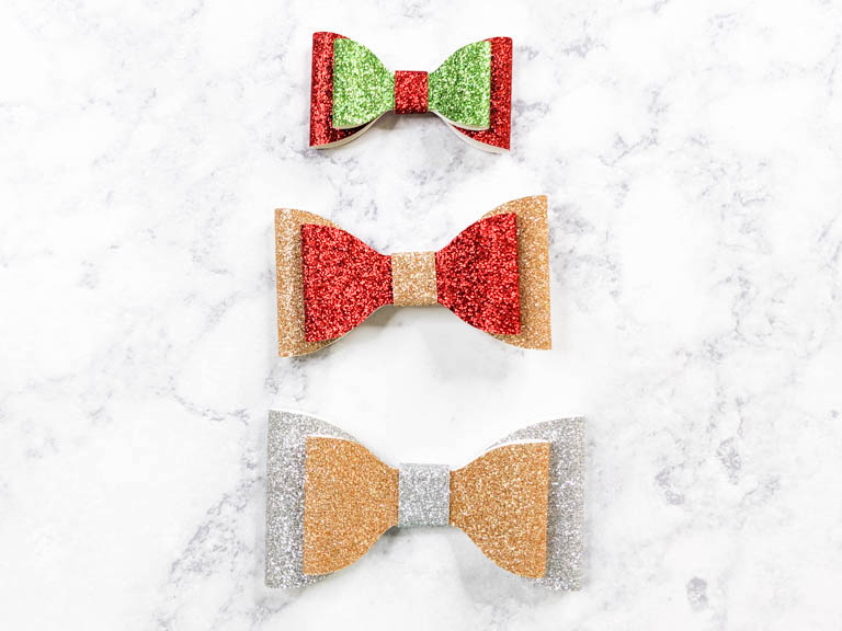 Christmas themed stacked hair bows in three sizes. small, medium and large.