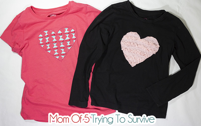 Two t-shirts, both have hearts reverse appliquéd on them.