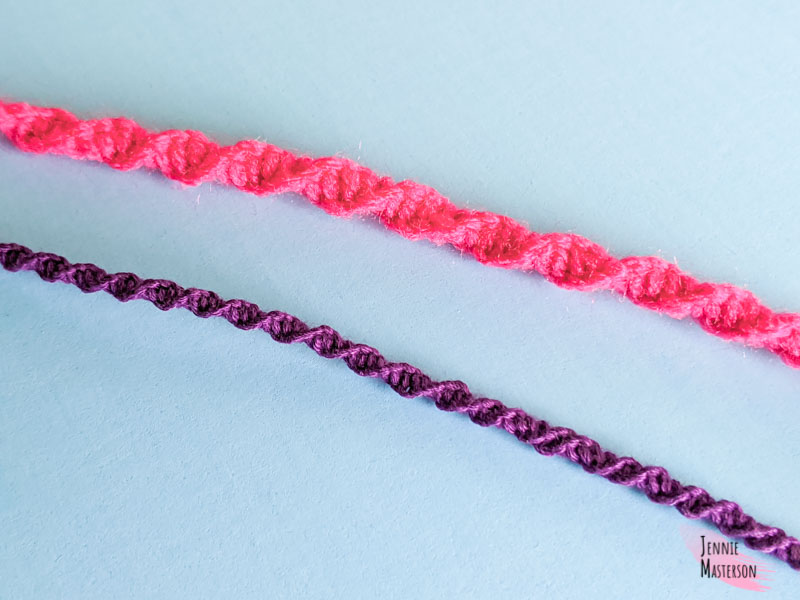 Showing the difference in size between a bracelet made with embroidery floss and yarn.