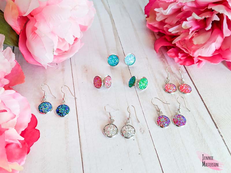 Several pairs of faux druzy stone earrings