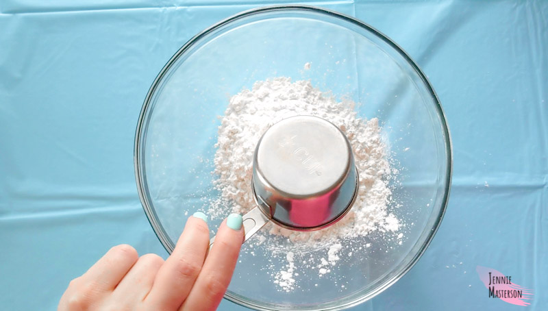 Pouring corn starch into mixing bowl.