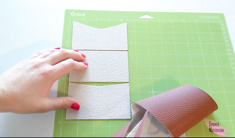 peeling excess material away from cricut cut mat.