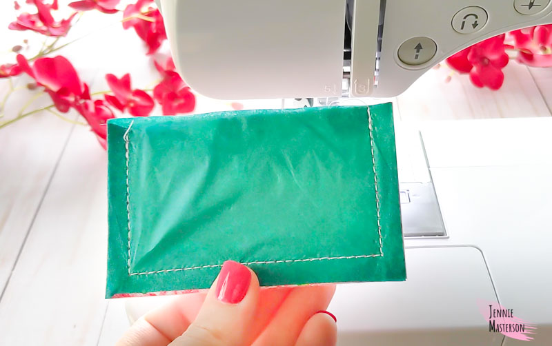 card wallet completely sewn with tissue paper still attached.