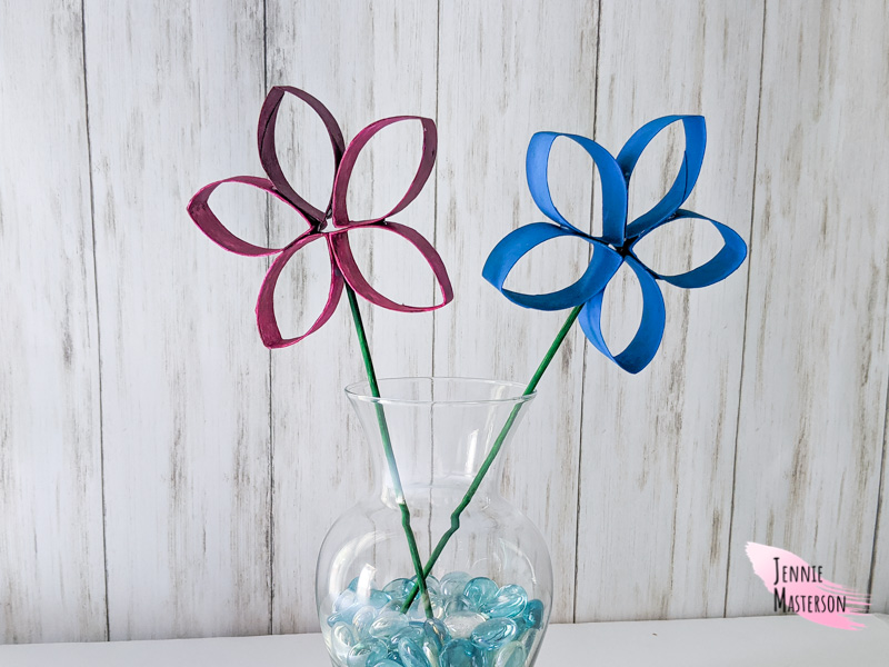flowers made from empty toilet paper rolls in a vase.