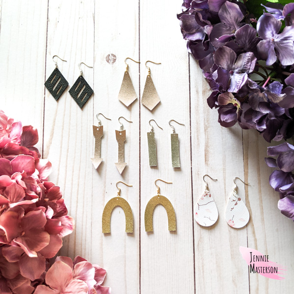 Several pairs of faux leather earrings.