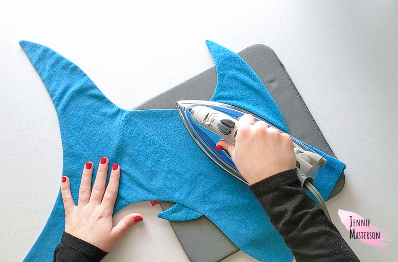 Ironing the shark stocking down.