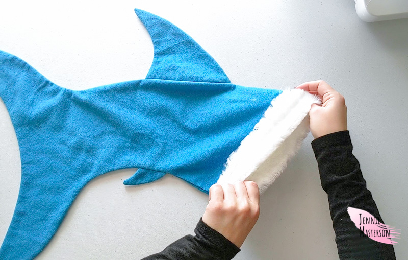 Pulling the cuff out of the shark body.