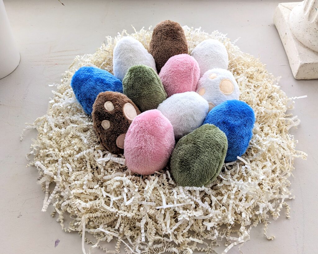 egg plushies in a nest