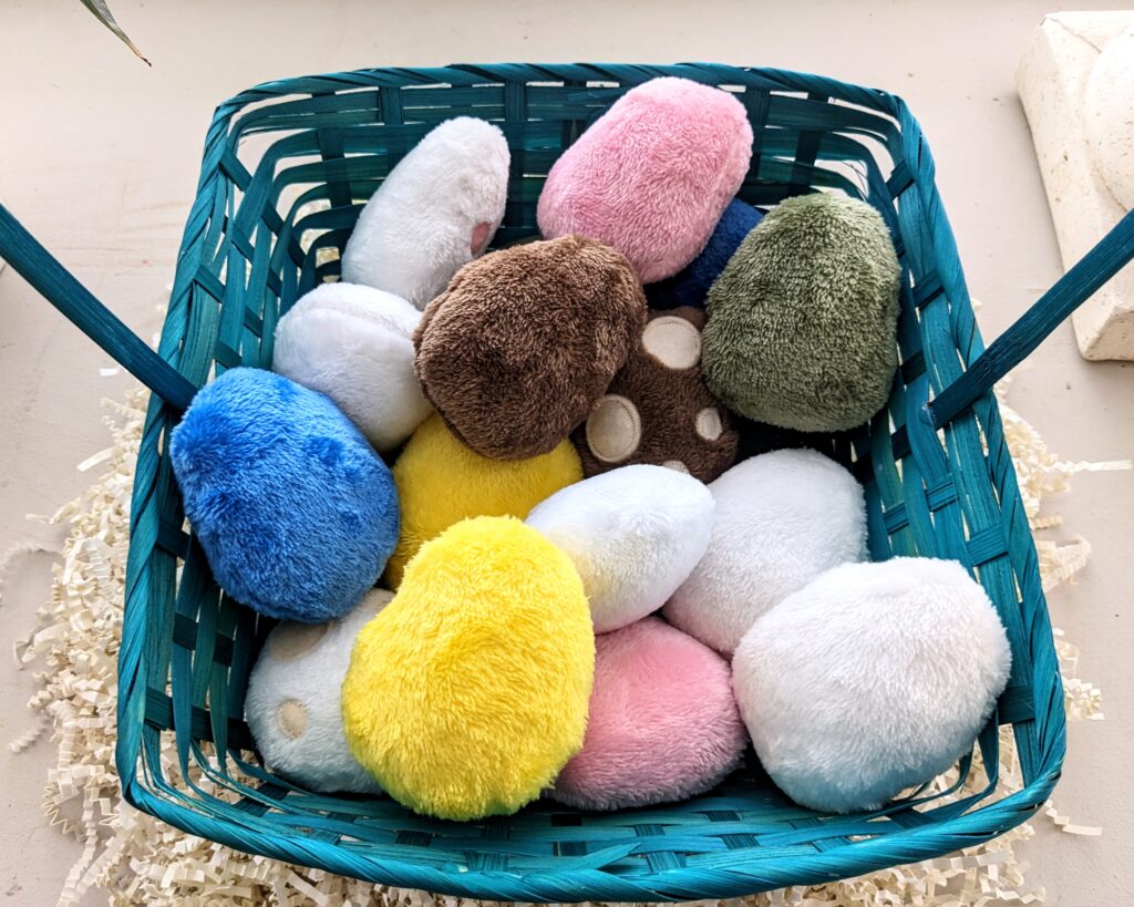 basket full of egg plushies